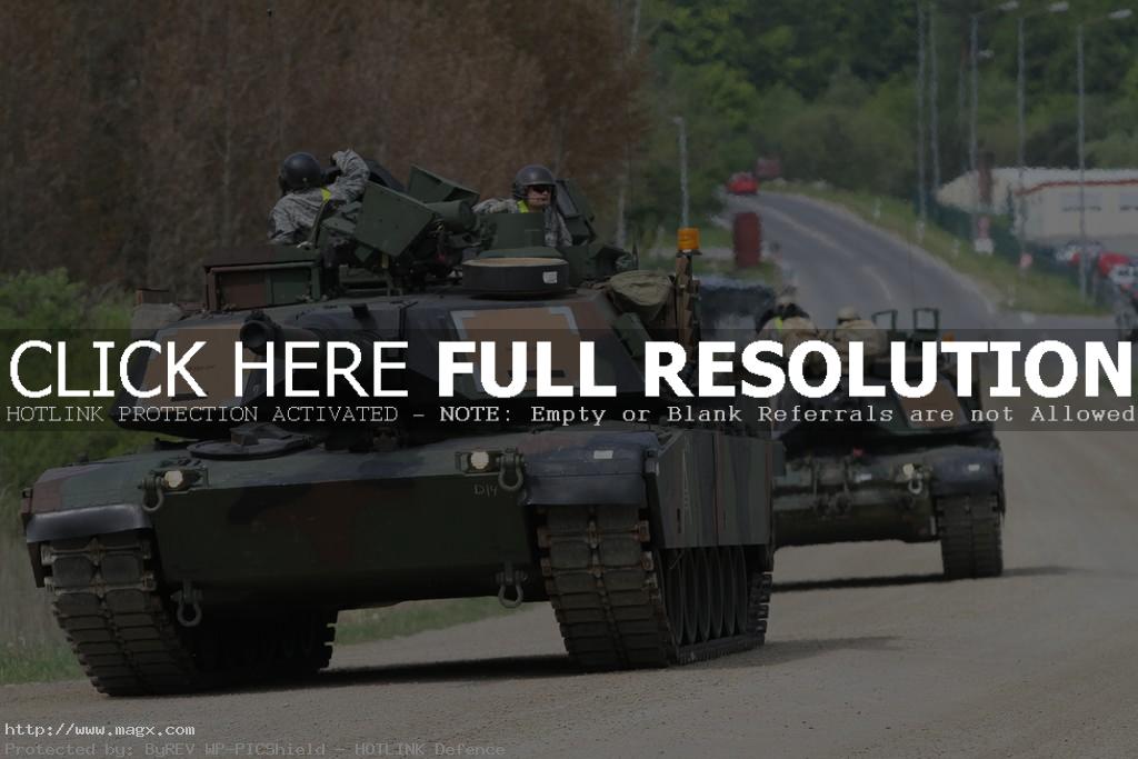 military tanks Military Tanks Riding on Civilian Road